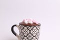 Closeup of a mug of hot chocolate with marshmallows isolated on a gray background Royalty Free Stock Photo