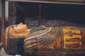 Closeup of a mummy of a female pharaoh with intricate artwork on it in the Egyptian Museum in Cairo