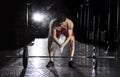 Closeup of muscular athlete clapping hands before barbell worko