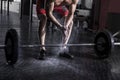 Closeup of muscular athlete clapping hands before barbell worko Royalty Free Stock Photo