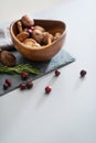 Closeup on mushrooms lingonberries and rosmarinus on table