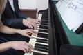 Closeup musician hands playing piano on piano keyboard