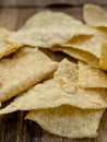 Closeup of Nacho Tortilla Chips on a rustic wooden table Royalty Free Stock Photo