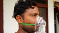 Closeup of nasal cannula for oxygen delivery on a male patient. Nasal mask on man face with regular oxygen supply