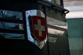 Closeup of the national swiss flag emblem on an SBB Ae 6 and 6 at Erstfeld, Switzerland Royalty Free Stock Photo