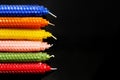 Closeup of natural beeswax candles on black Royalty Free Stock Photo