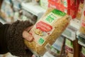 Closeup of natural pasta in hand at Cora Supermarket