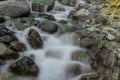 Closeup natural waterfall oasis with stones background Royalty Free Stock Photo