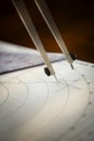 Closeup of a navigator\'s radar plotting chart with a triangle and compass divider Royalty Free Stock Photo