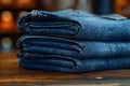 Closeup of neatly folded blue jeans stacked for a hig. Concept Clothing Photography, Styled Jeans, Royalty Free Stock Photo