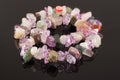 Closeup necklace from crystals of amethyst, fluorite, jasper and rose quartz