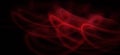 Neon red light curve wave pattern abstract flowing in a isolated Black background with copy space for texting Royalty Free Stock Photo