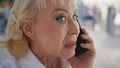 Closeup nervous pensioner calling smartphone expressing negative emotions. Royalty Free Stock Photo