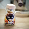 Closeup of Nescafe instant coffee Crema in a glass jar standing on a table