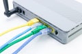 Closeup of network cables connected to wifi router on white Royalty Free Stock Photo