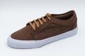 Closeup of a new brown sneaker on a white surface Royalty Free Stock Photo