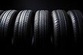 Closeup new car tires for sale at tyre store. Balck rubber car tire with modern tread at auto repair shop. Winter tires at auto Royalty Free Stock Photo