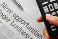 Closeup on new opportunities text and hand phone Royalty Free Stock Photo