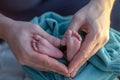 Parent holding hands feet. Newborn baby ankle Royalty Free Stock Photo