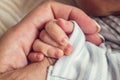 Closeup newborn and mothers hands