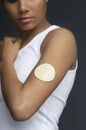 Closeup Of Nicotine Patch On Female's Arm