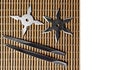 Ninja Star Shurikens with throwing spikes on Wooden Background,