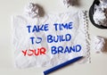 TAKE TIME to build your brand lettering on white crumpled paper Royalty Free Stock Photo