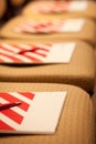 Closeup of notepad with pen for agenda on chairs in empty corporate conference room before business meeting Royalty Free Stock Photo