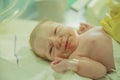 Closeup of nurse clipping navel on a newborn Caucasian baby boy Royalty Free Stock Photo