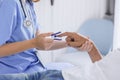 closeup nurse doctor using fingertip pause oximeter measures blood oxygen saturation level with patient