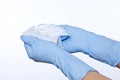 Closeup of nurse hands in surgical gloves openning sterile wound dressing compress