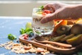 Closeup nutrition yogurt with many fruits on table and chef hand. Food cuisine and drinks concept. Organic dessert theme Royalty Free Stock Photo