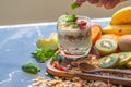 Closeup nutrition yogurt with many fruits on table and chef hand. Food cuisine and drinks concept. Organic dessert theme Royalty Free Stock Photo