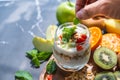 Closeup nutrition yogurt with many fruits on table and chef hand. Food cuisine and drinks concept. Organic dessert theme Royalty Free Stock Photo