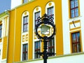 Closeup of retro style street lantern lamp on cast iron post. colorful yellow stucco exterior wall background Royalty Free Stock Photo