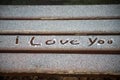 The word ` I love you`  writed in the freeze on wooden bench in the street Royalty Free Stock Photo