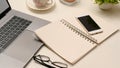 Closeup, Office desk workspace with open spiral notebook