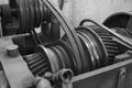 Closeup of oily metal gears and belt of old Lathe Machinery. Selective focus.
