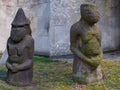 Closeup old ancient statues near a wall