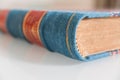 Closeup of an old blue, red and gold vintage book Royalty Free Stock Photo