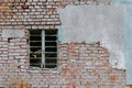 Closeup of an old building with weathered brick wall and window Royalty Free Stock Photo