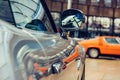 Closeup of old car with silver colored paint on automobile show. Royalty Free Stock Photo