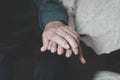 Old man and old woman holding hands Royalty Free Stock Photo