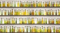 Closeup of old colorful beer bottles on the shelves under the lights Royalty Free Stock Photo