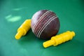 Leather cricket ball and wickets Royalty Free Stock Photo