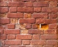 Closeup of old damaged brick wall with holes in place of some bricks Royalty Free Stock Photo