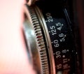 Closeup of old dirty and dusty retro roll film camera lens Royalty Free Stock Photo