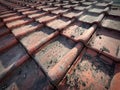 Closeup on old , dirty rooftiles neatly lined up in a pattern on a roof of an older house