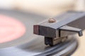 Closeup of old and dusty vinyl record player with arm and needle in focus Royalty Free Stock Photo