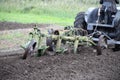 Ploughing with old-time plough with three plow blades Royalty Free Stock Photo